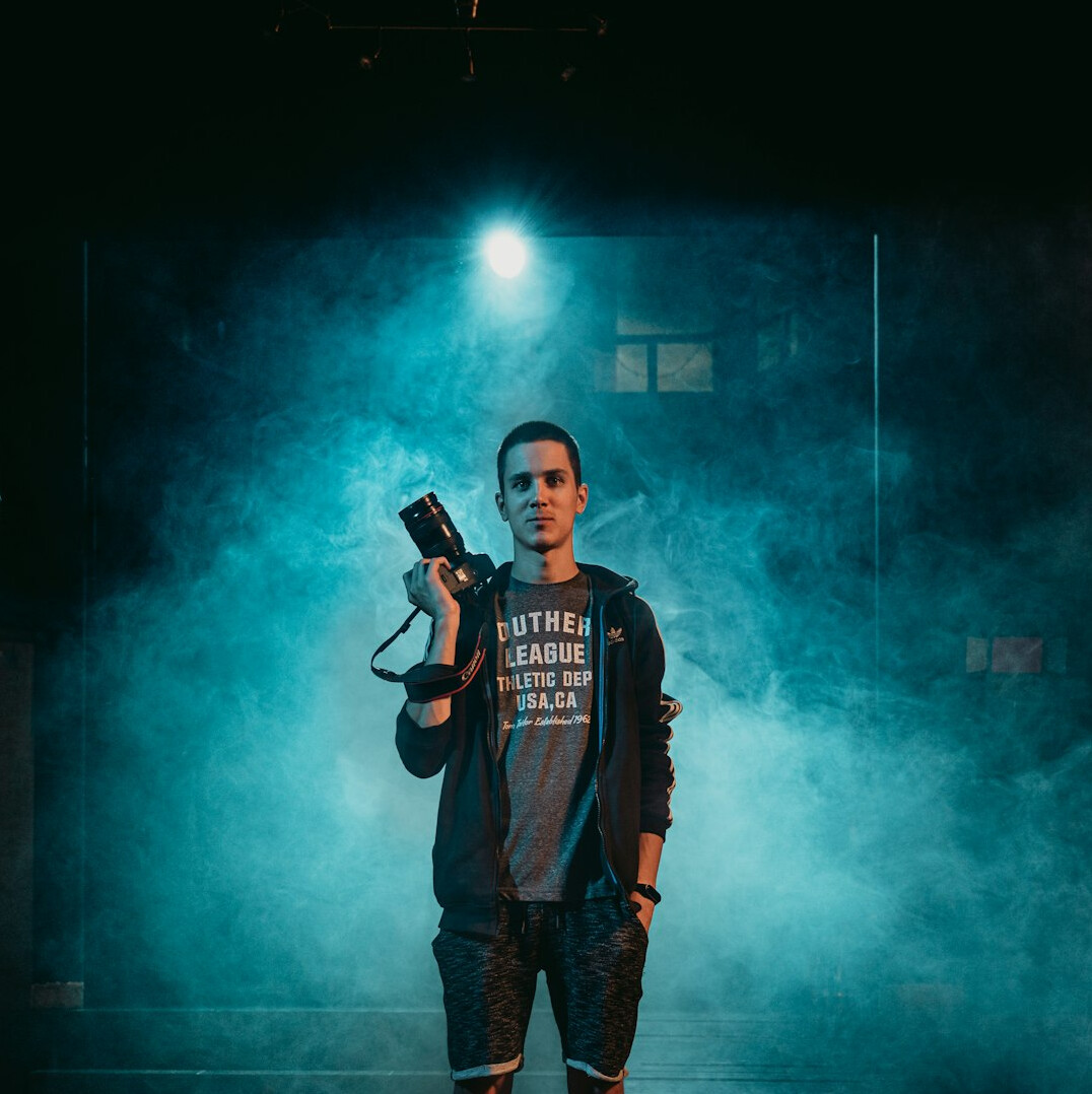Camera operator filming in a TV studio